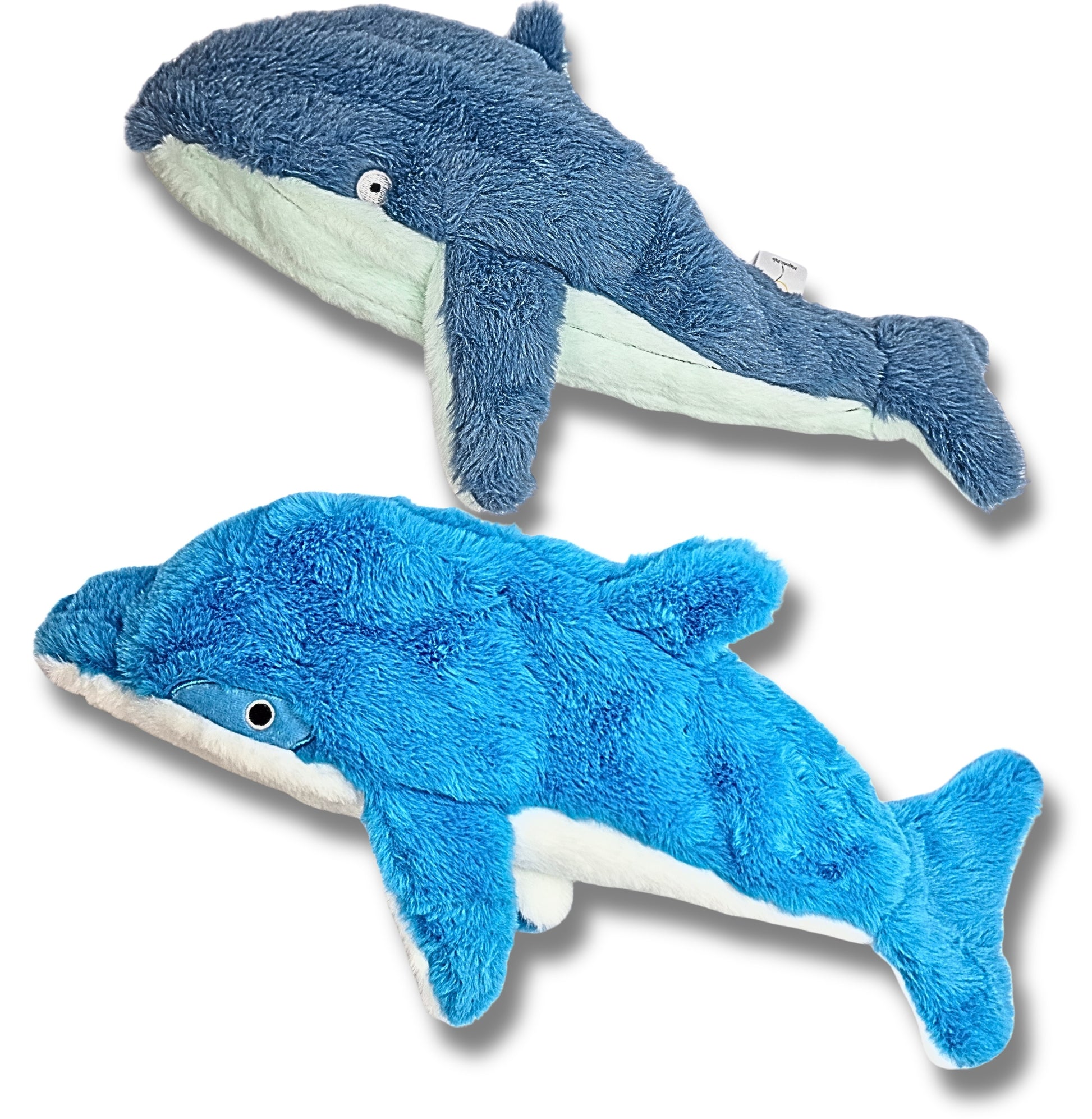 Blue and dark blue dolphin and whale plush toys on a white background